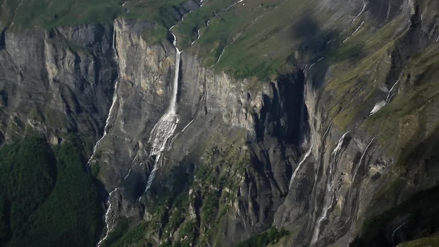Waterfalls cascading down steep cliff faces