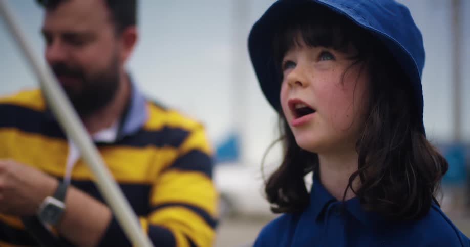 A father and daughter are fishing