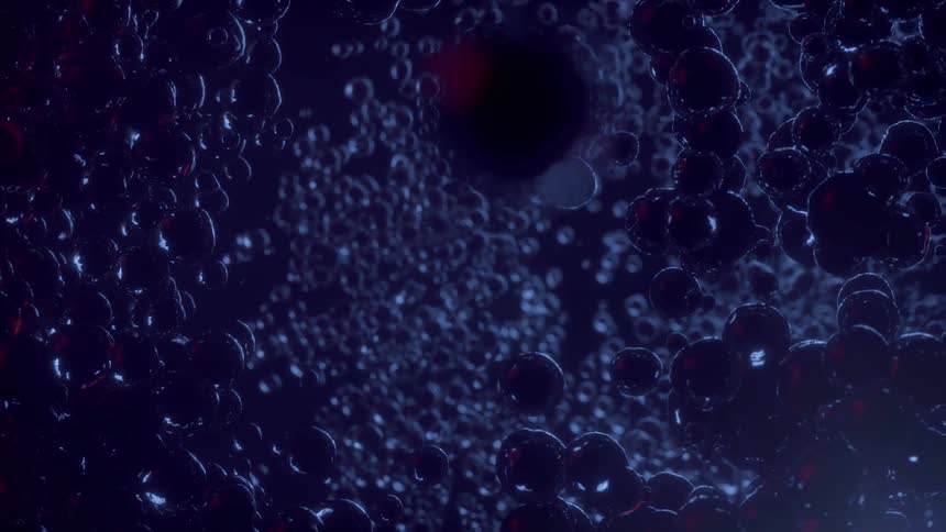 Single cell life forms swarming underwater like bubbles