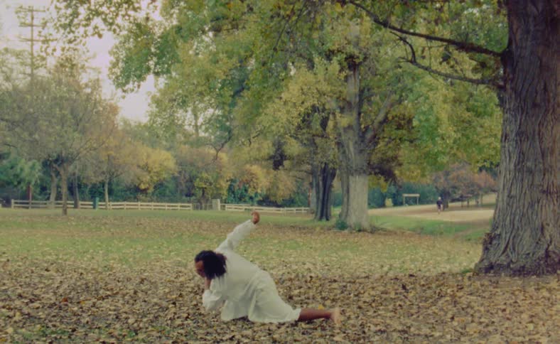 A man is dancing in the park