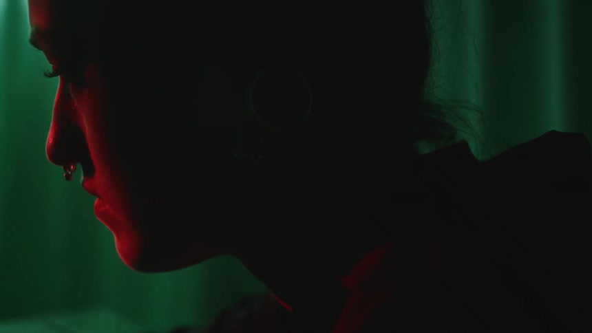 A woman is looking in the dark