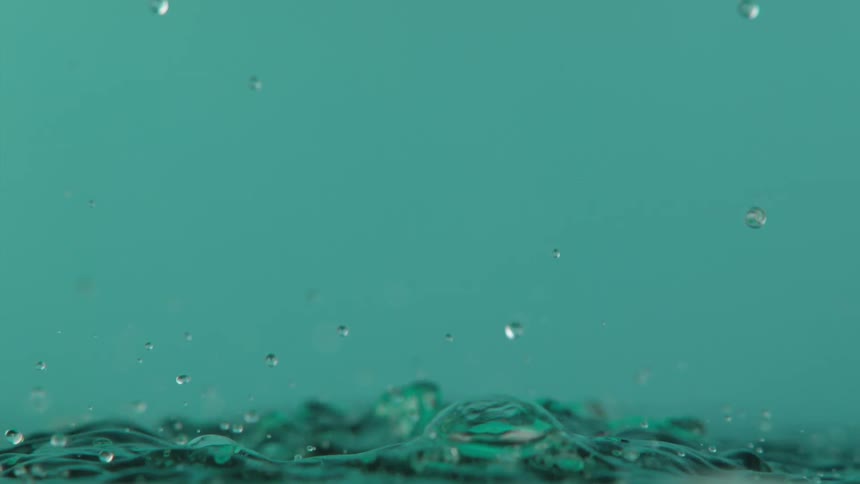 Liquid drops are falling and splashing together