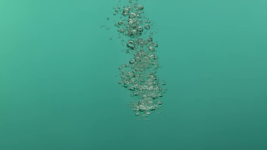 A water droplet expands while dropping into pool water