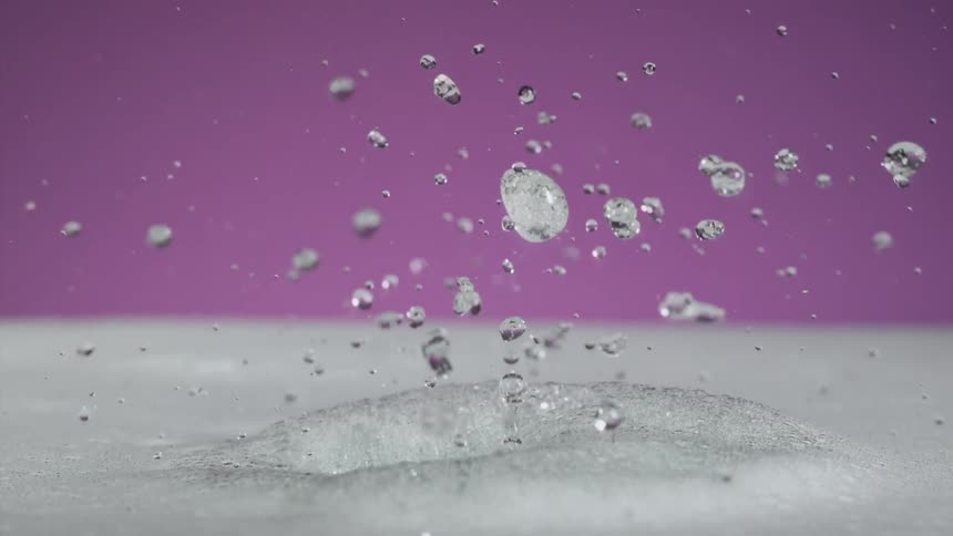 Falling water and splash upward from foaming water crash into each other