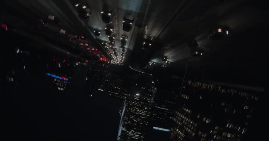 The view is of the downtown area and cars driving down the high way