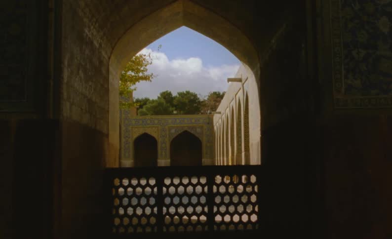 The view is inside of a building and you can see the outdoors