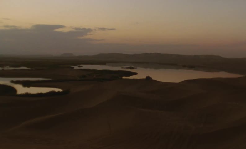 Aerial view of a landscape is displayed during dusk