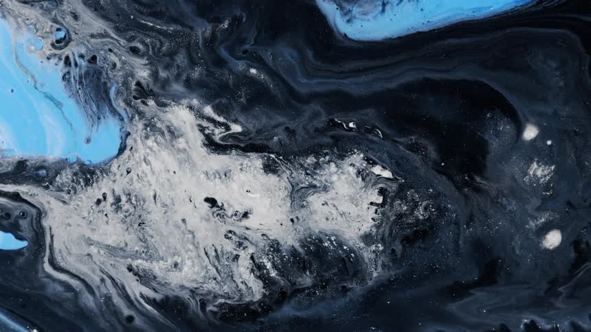 Blue and white areas are blending with a textured moving dark gray substance