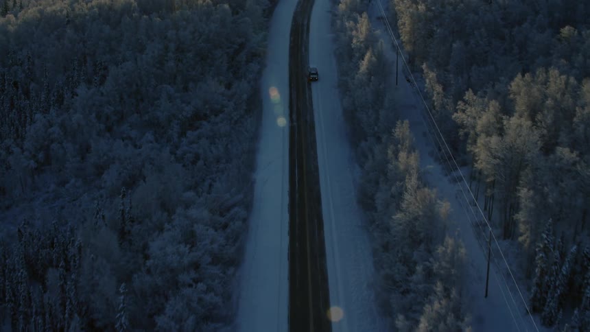 A car drives down the road