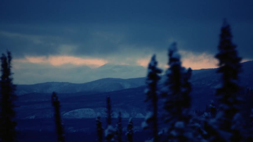 Heavy storm clouds are over the mountain