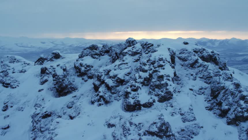 Heavy snow settles between ridges on a mountain