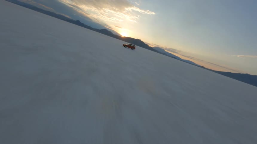 A car is driving over the landscape
