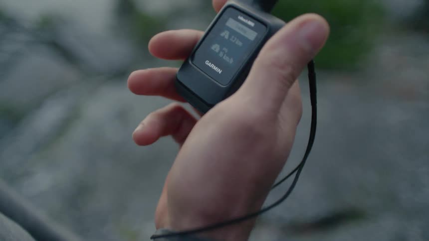 A person raises the device in their hand