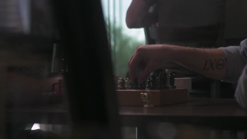 A person is playing chess