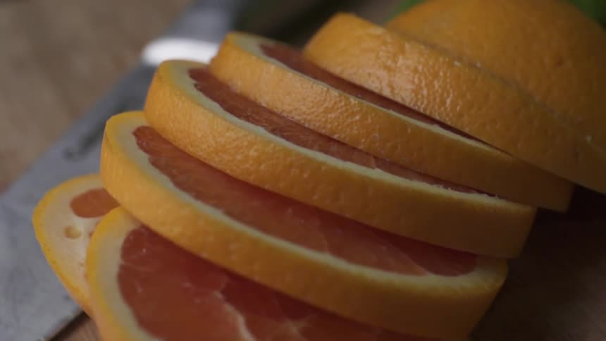 An orange is neatly sliced