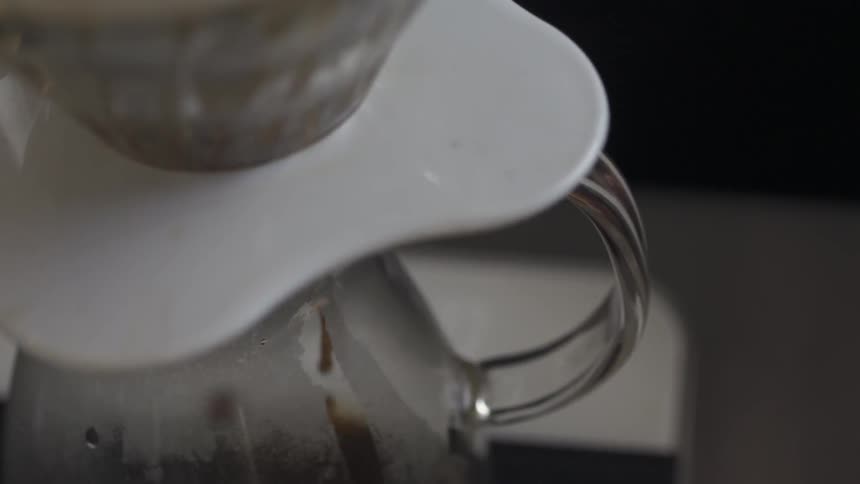 Coffee is being brewed in a pot