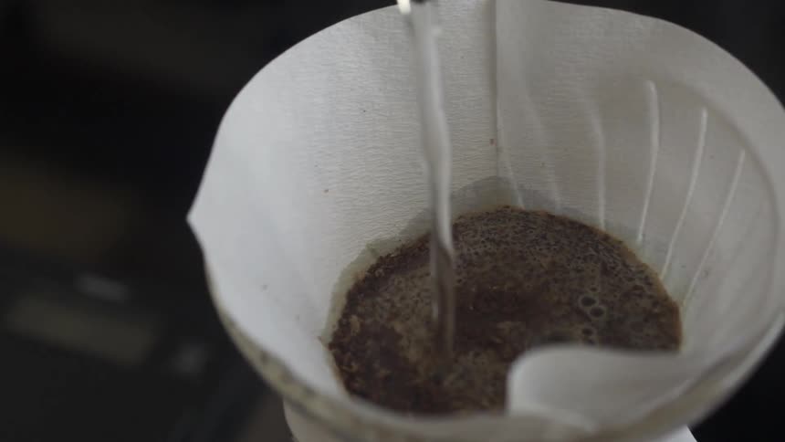 Water is poured into a filter