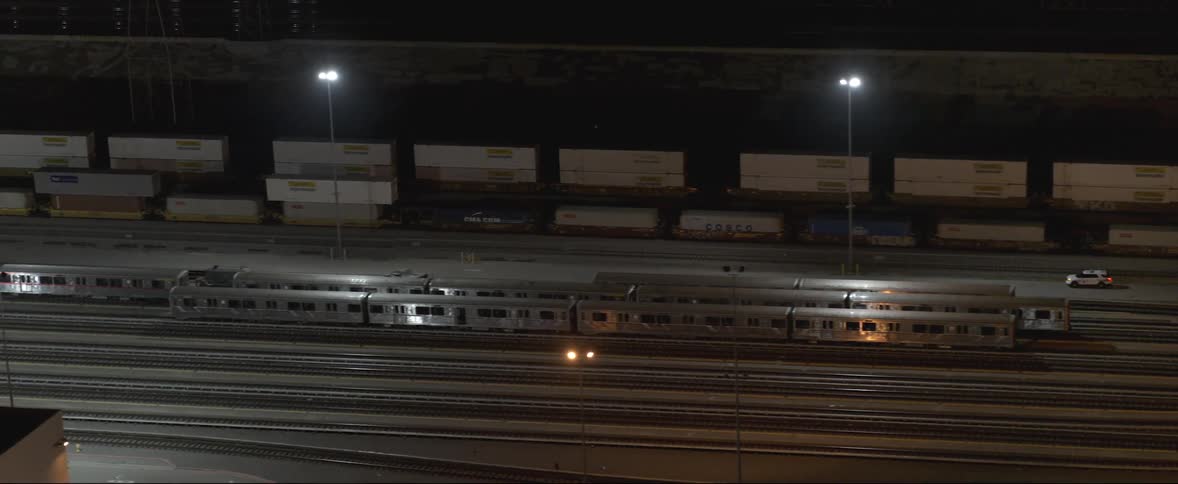 Empty trains sit parked at a train station