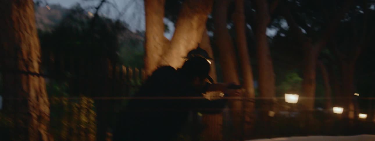 Man wearing black cap and jacket shoots at police and runs away in park