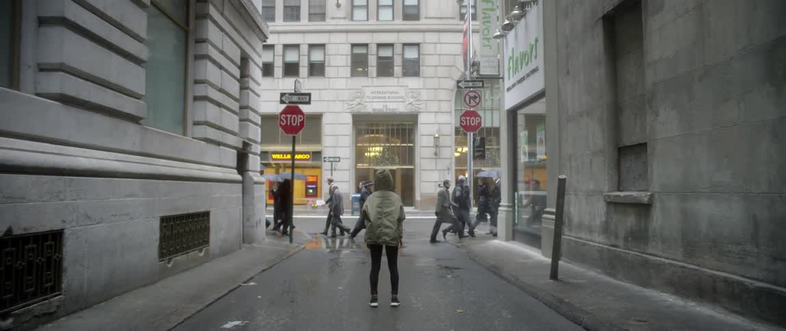 A person watching people come and go in the city