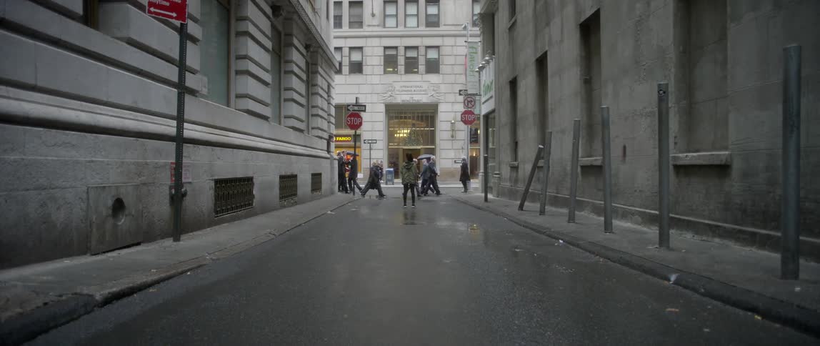 Pedestrians walk on a city street