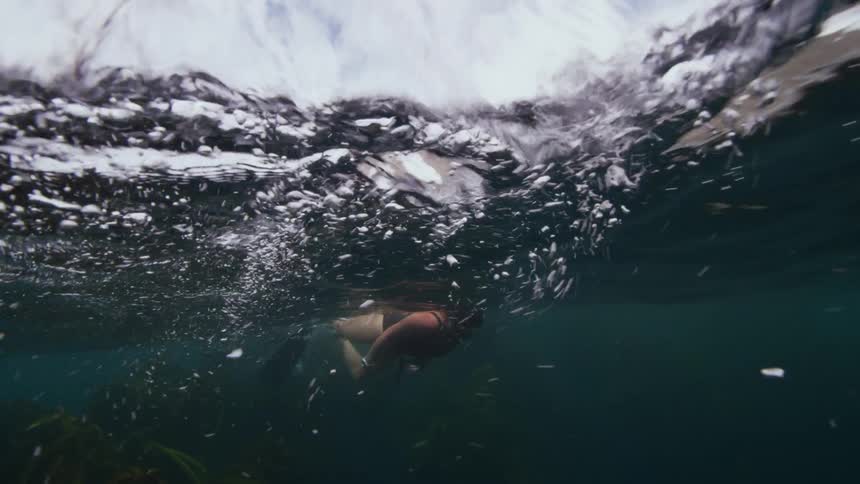 Woman diving under water