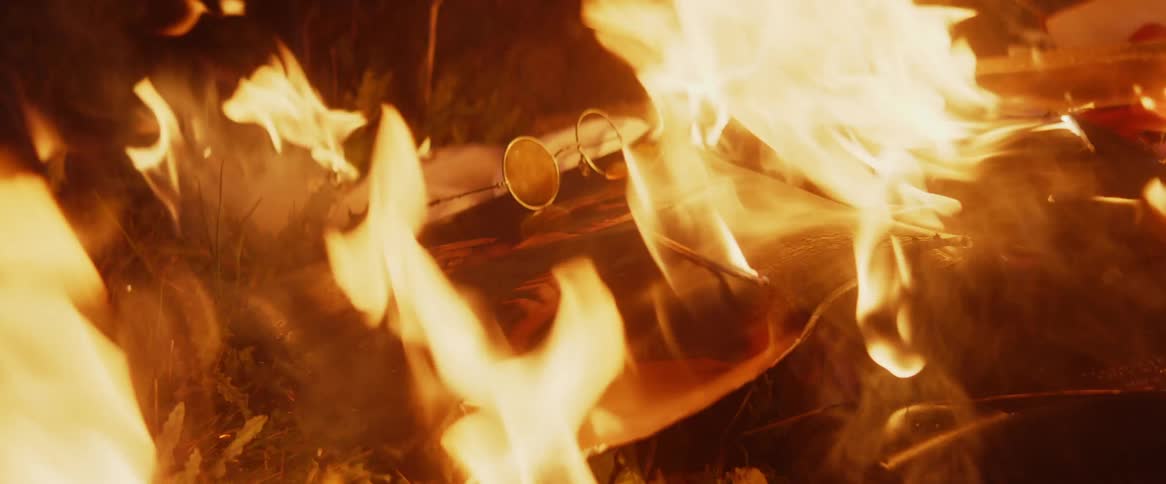 Wood chips and debris burn in a fire