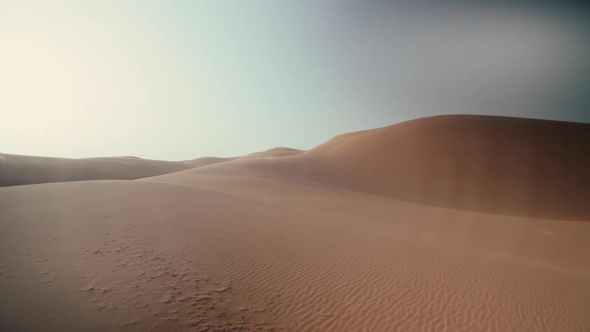 Right panning view of sand dunes stretching to the horizon in Saudi Arabia