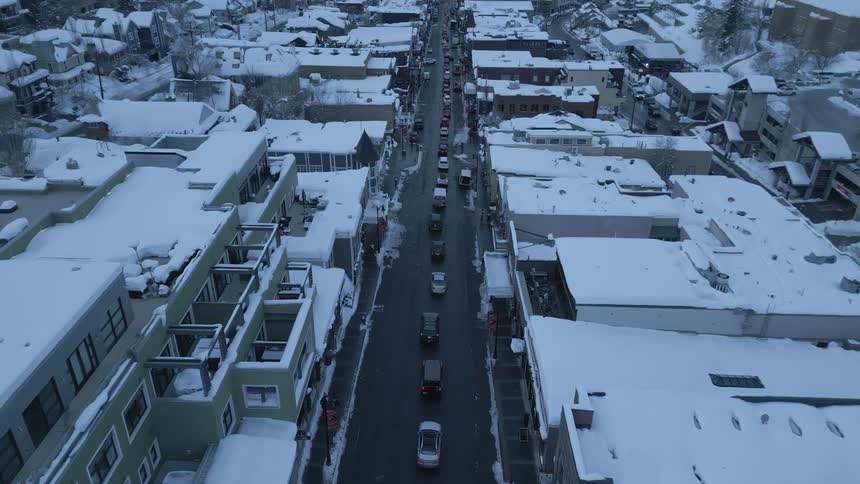 A long traffic jam along a road in a city on a winter evening