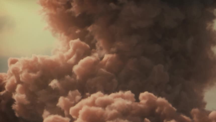 A cluster of strange pink clouds move as they float in the sky
