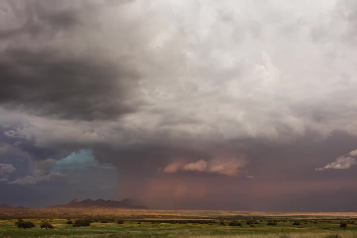 A monsoon thunderstorm moving in and causing a red look on the horizon