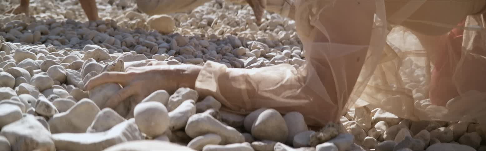 Someone moving some rocks attempting to do something
