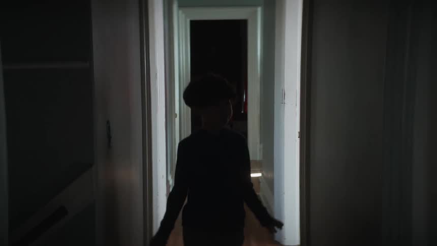 Kid walking through a hallway