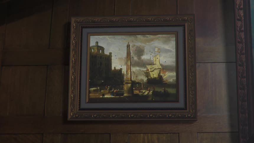 A framed painting is moving