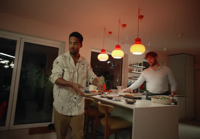 Same sex couple prepare dinner