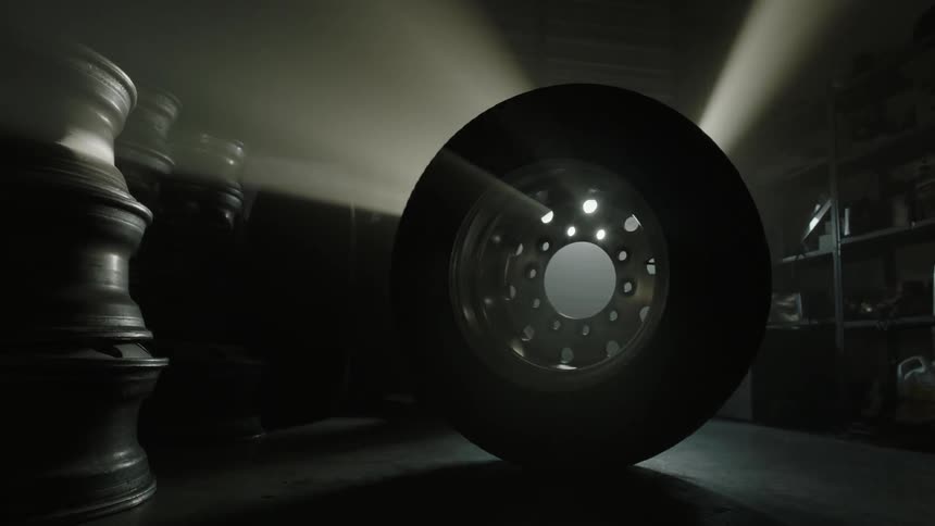 A tire is turning in a garage