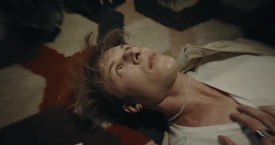 A close up of man on the ground freaking out about something