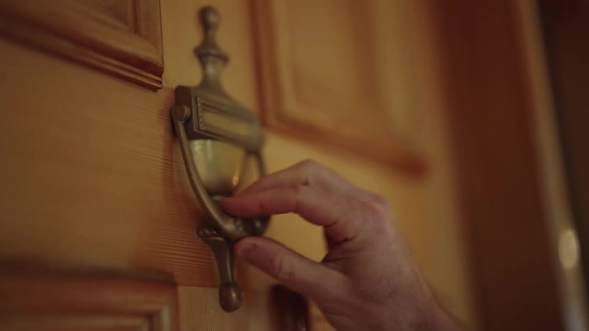 A person knocks on the door