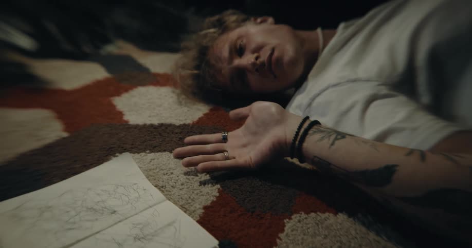 A man twitches on the floor