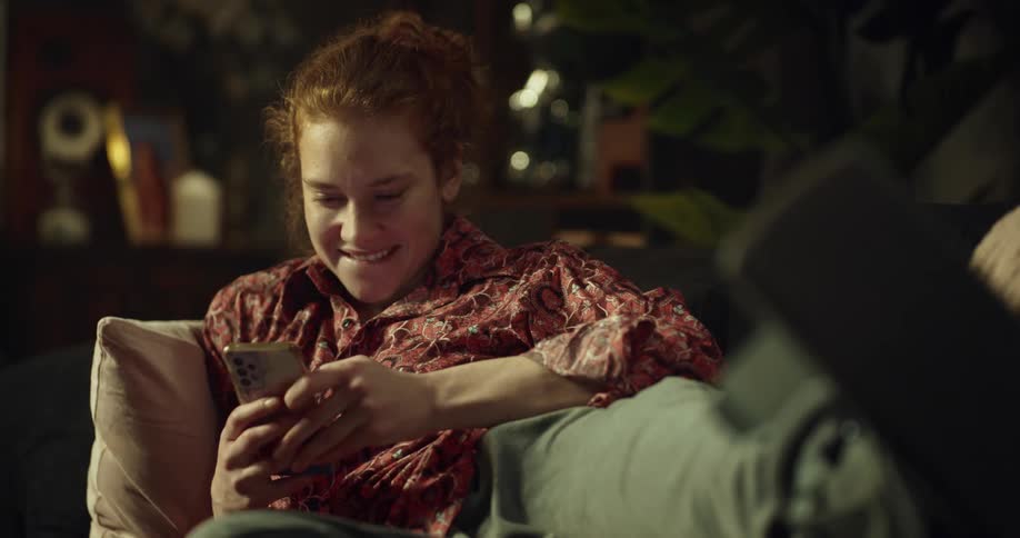 A woman picks up her cell phone