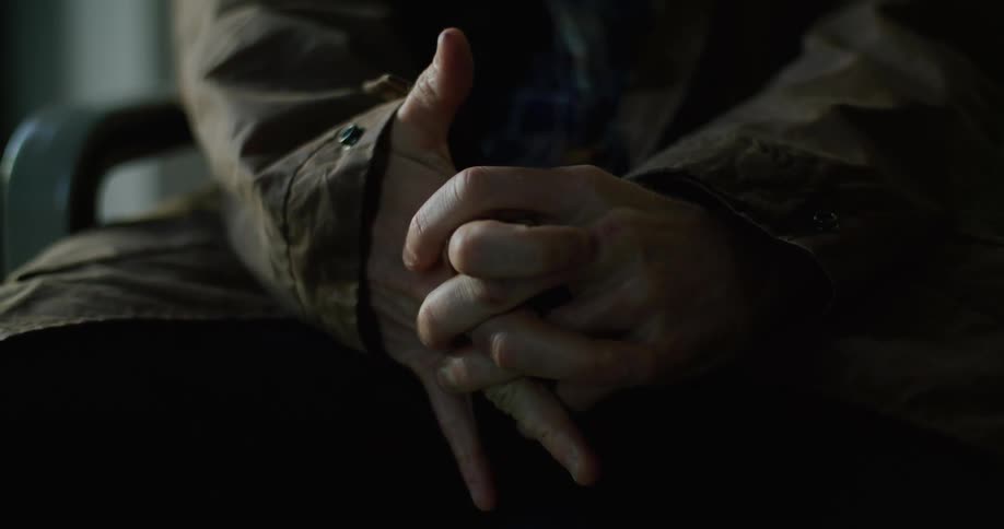 A persons hands are shaking