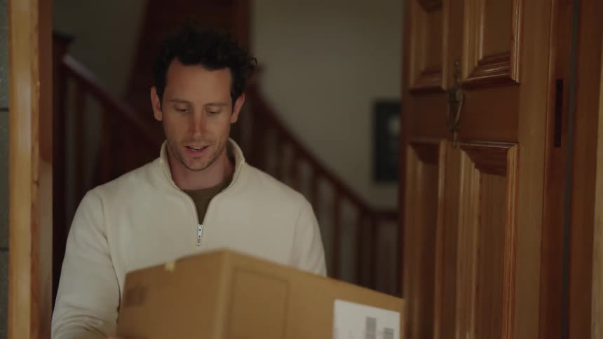 Delivery man delivers a parcel