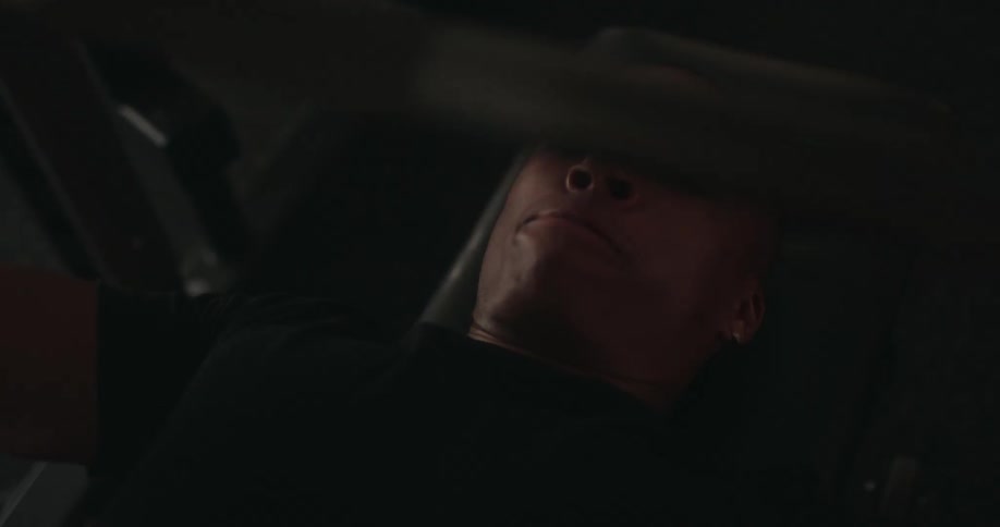 A man is bench pressing