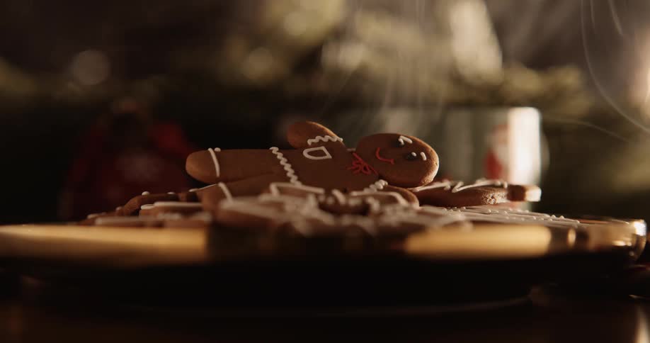 Smoke hovering over gingerbread men cookies displayed on a table