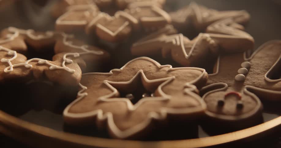 Holiday gingerbread cookies are on a tray on a table