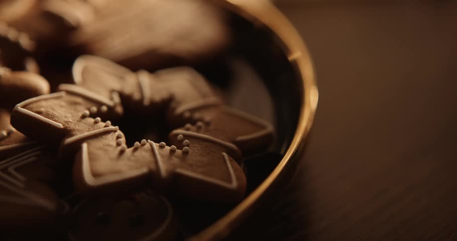Star shaped cookie with icing on display on round plate