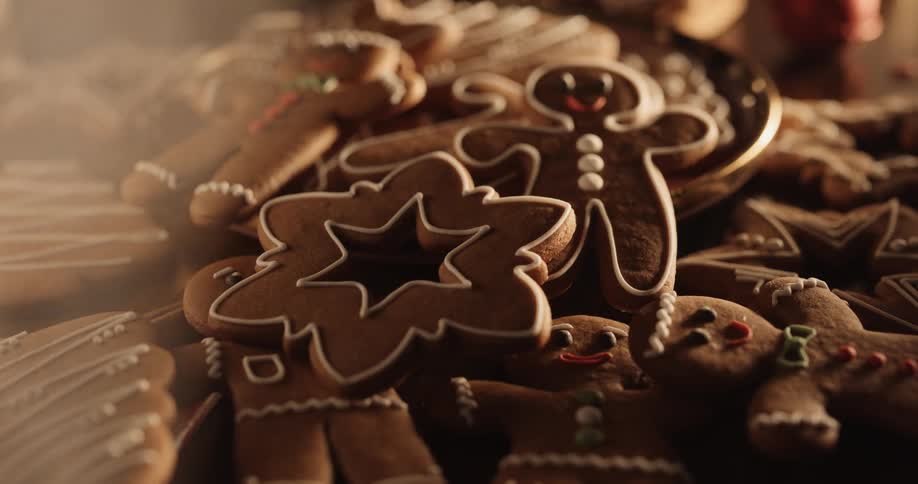 Gingerbread men smile in the cookie pile as smoke moves over them