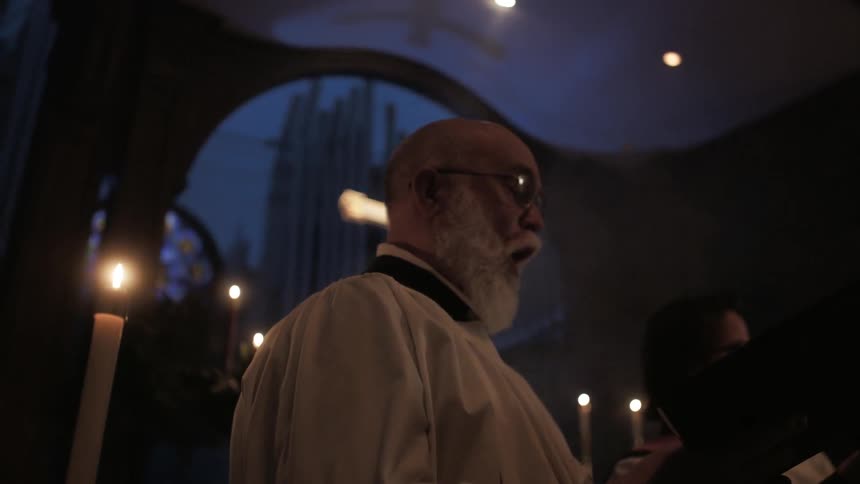People are singing in a church choir