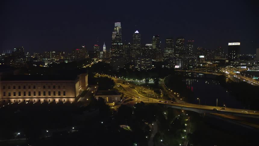 A nighttime aerial approach to Philadelphia skyline with a stunning view of the Philadelphia Museum of Art