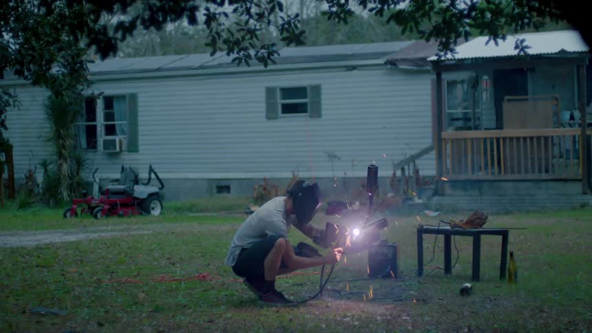 A man working on a project outside